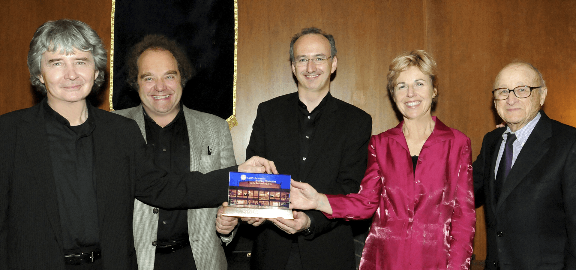 People holding an award