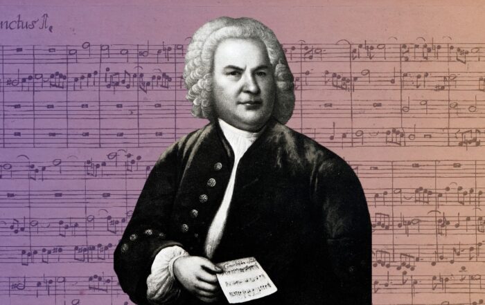 J.S. Bach in front of sheet music of a Fugue