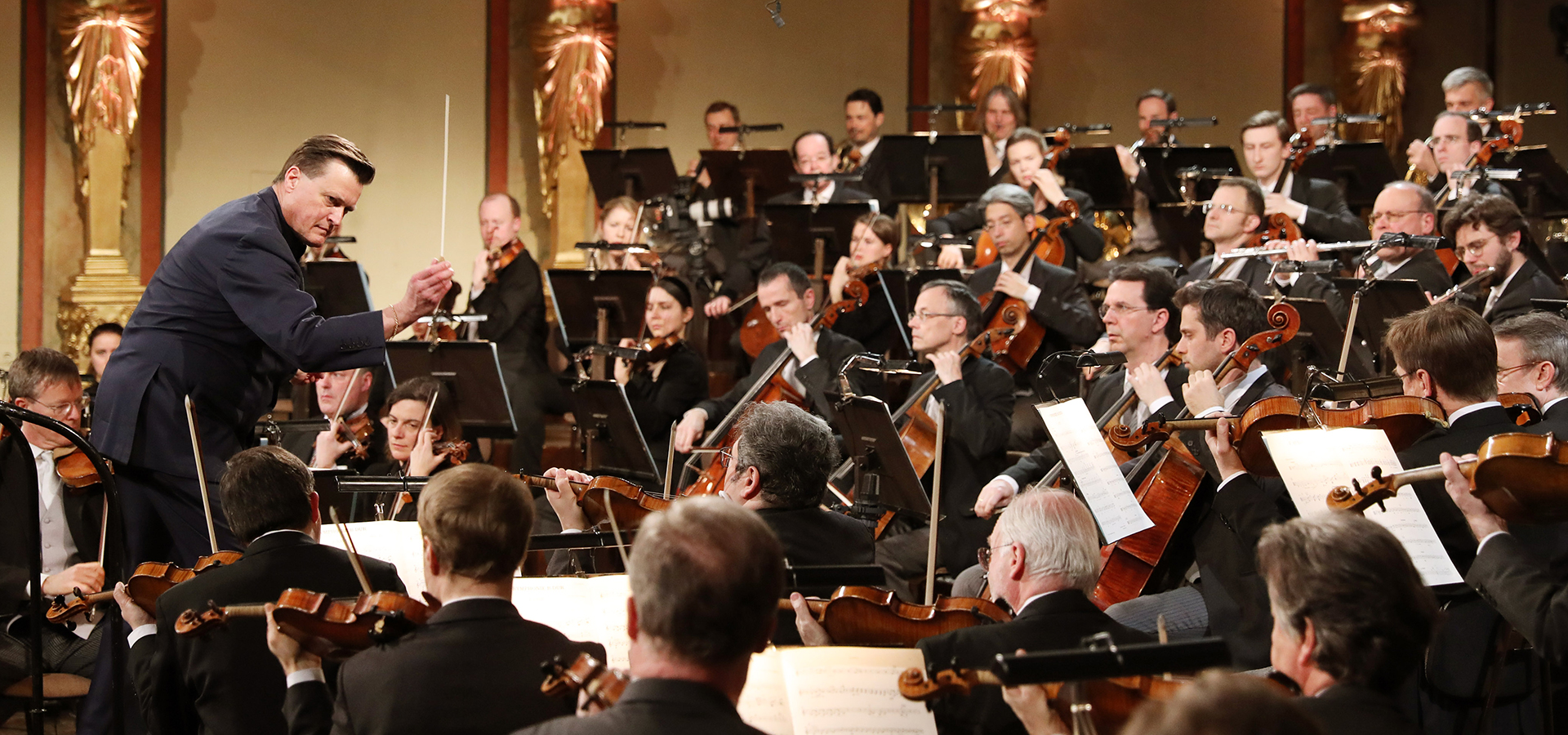 Vienna Philharmonic Orchestra performing on stage