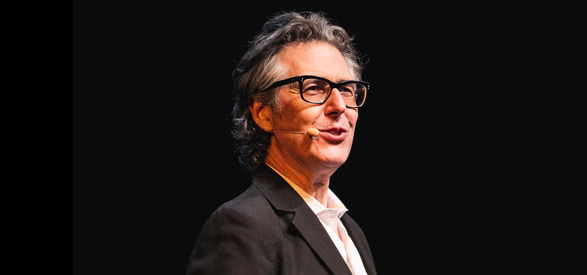 Ira Glass speaking on stage