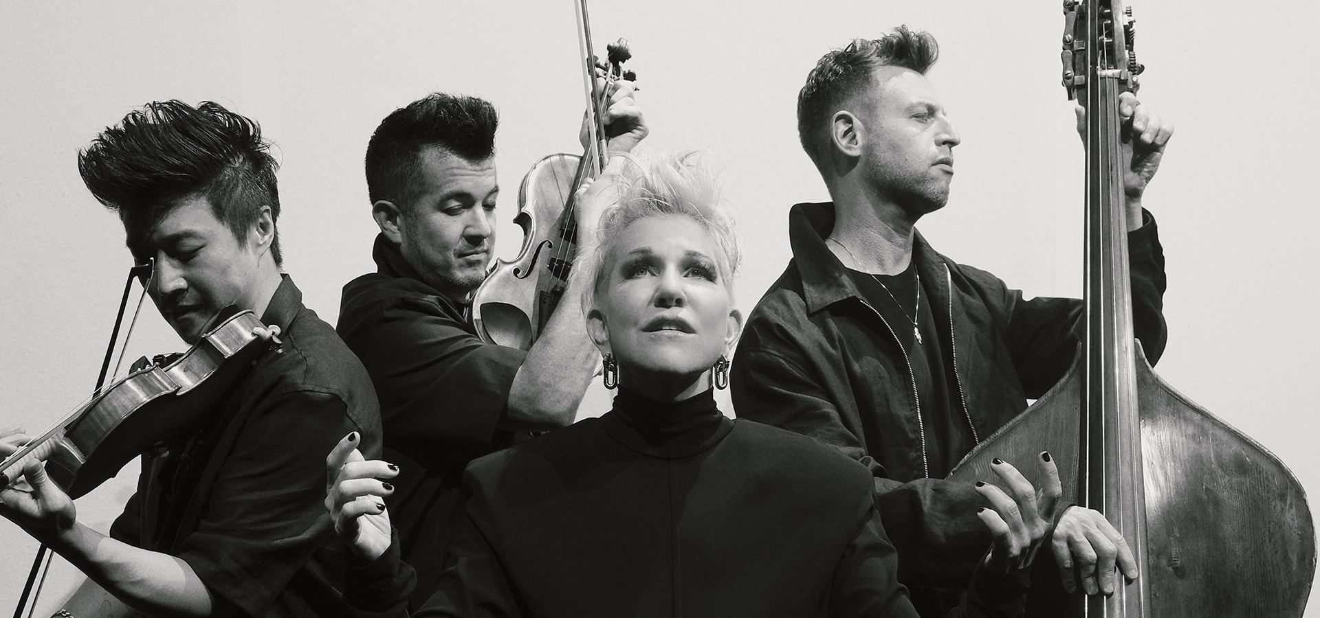 All dressed in black is a group of three men with string instruments -- Time for Three -- and a blond woman, Joyce Didonato