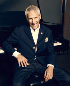 Burt Bacharach photographed with piano