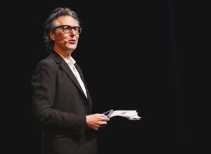 Ira Glass speaking on stage
