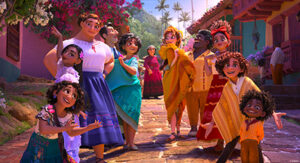 The characters of the Madrigal Family from Disney’s Encanto stand together in their town.