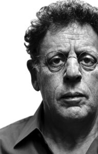 Dramatic, black and white close up of Philip Glass.