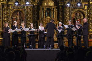 The Tallis Scholars perform in an ornate golden chappell.