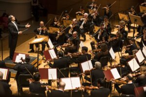 Riccardo Muti conducts the Chicago Symphony Orchestra as they perform onstage.