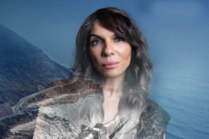 Lara Downes, a young woman with dark hair, superimposed on a running train.