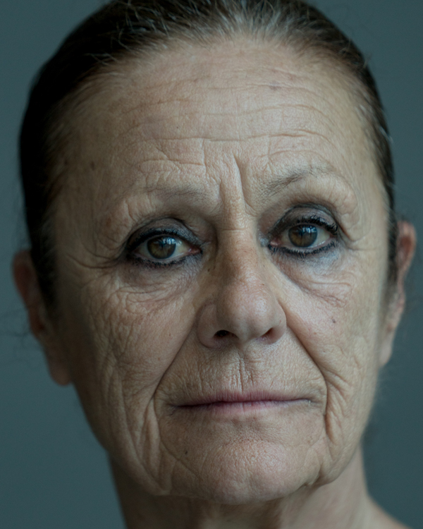 A close up image of artist Malou Airaudo, an older woman wearing black eyeliner.