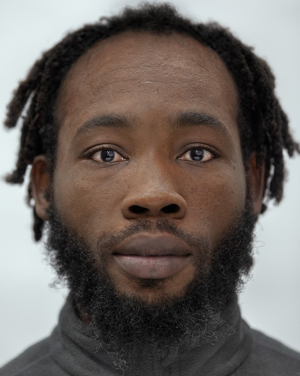 Portrait photo of artistTom Jules Samie, a middle aged black man with a long beard.