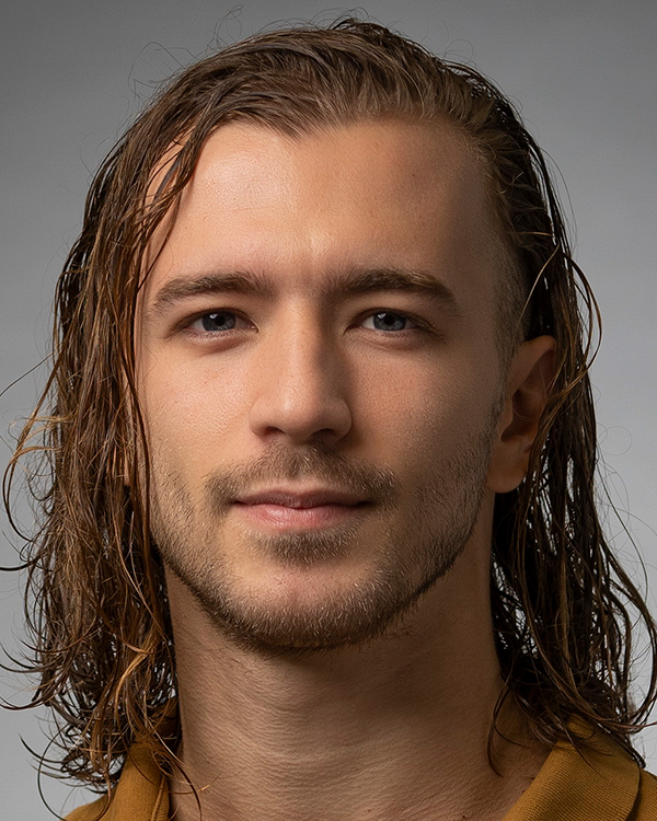 Igor Ptashenchuk, a light-skinned man with long, wavy, light brown hair, looks into the camera