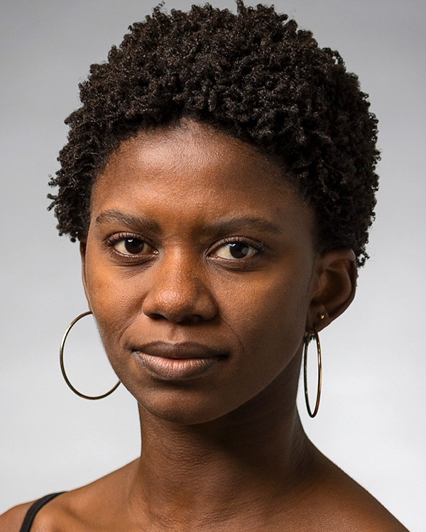 Londiwe Khoza, a black woman with short, curly dark hair, smiles slightly into the camera