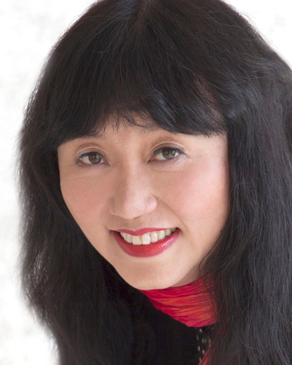 A headshot image of Wu Han, an Asian woman with long black hair and bangs looking into the camera.