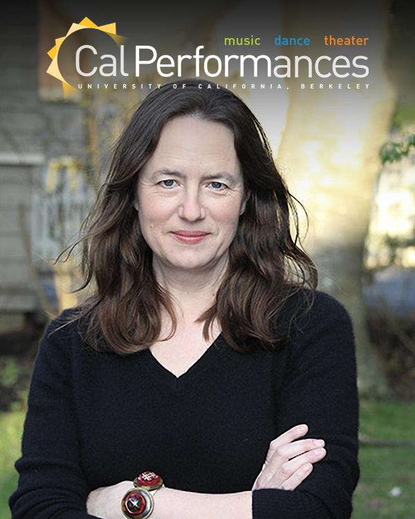 Heather Cox Richardson, a white woman with long, brown wavy hair, looking into the camera