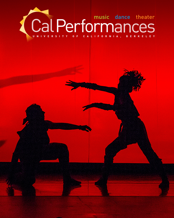 The silhouettes of two dancers of the Twyla Tharp Dance Troupe onstage in front of a red background, one on one knee and the other reaching out to the former.