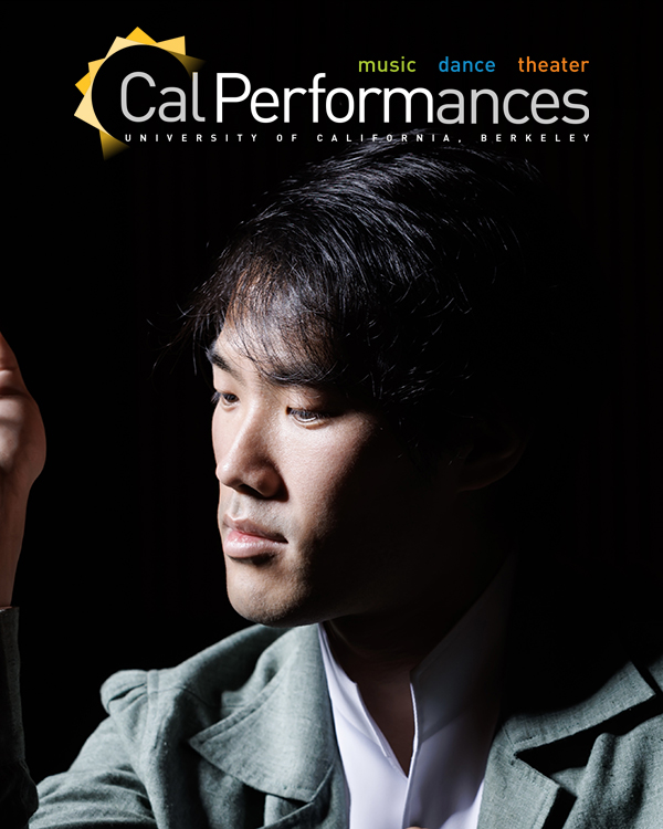 Bruce Liu, a young Chinese-Canadian man, sits at a piano looking to his right in a contemplative pose.
